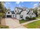 Two-story house with driveway and landscaping at 1470 Place Picardy, Winter Park, FL 32789