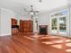 Gathering room with hardwood floors, fireplace, and access to the pool area at 1470 Place Picardy, Winter Park, FL 32789