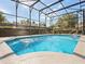 Inviting swimming pool with screened enclosure at 1470 Place Picardy, Winter Park, FL 32789