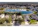 Aerial view of neighborhood with lake and houses at 15319 Stonebriar Way, Orlando, FL 32826