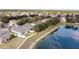 Aerial view of lakefront home and neighborhood at 15319 Stonebriar Way, Orlando, FL 32826