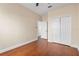 Bedroom with wood-look floors and double-door closet at 15319 Stonebriar Way, Orlando, FL 32826