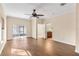 Bright bedroom with wood-look floors and ceiling fan at 15319 Stonebriar Way, Orlando, FL 32826