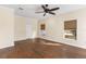 Spacious bedroom with wood-look floors and large windows at 15319 Stonebriar Way, Orlando, FL 32826