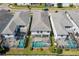 Aerial view of community with multiple homes and pools at 1551 Flange Dr, Davenport, FL 33896