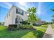 Two-story house with white exterior, blue shutters, and a landscaped lawn at 1551 Flange Dr, Davenport, FL 33896