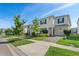 Two-story house with white exterior, blue shutters, and a landscaped lawn at 1551 Flange Dr, Davenport, FL 33896