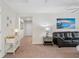 Bright hallway with light neutral walls and carpet at 1551 Flange Dr, Davenport, FL 33896