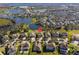 Aerial view showcasing home's location in a desirable neighborhood with lake access at 15944 Citrus Knoll Dr, Winter Garden, FL 34787