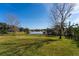 Private backyard with lake view and fenced-in area at 15944 Citrus Knoll Dr, Winter Garden, FL 34787