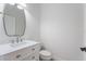 Modern bathroom with white vanity and a stylish mirror at 15944 Citrus Knoll Dr, Winter Garden, FL 34787