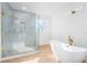 Spa-like bathroom with soaking tub and walk-in shower at 15944 Citrus Knoll Dr, Winter Garden, FL 34787