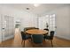 Dining room with a round wooden table and dark green chairs at 15944 Citrus Knoll Dr, Winter Garden, FL 34787