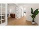 Light and bright hallway with wood floors and French doors at 15944 Citrus Knoll Dr, Winter Garden, FL 34787