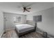 Spacious bedroom with wood-look floors and ceiling fan at 1640 Templewood Ave, Deltona, FL 32725