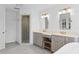 Elegant bathroom with double vanity, walk-in shower, and herringbone tile floor at 1812 Turnberry Ter, Orlando, FL 32804