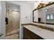 Elegant bathroom with dark brown vanity and mosaic shower at 1812 Turnberry Ter, Orlando, FL 32804