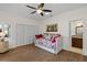 Charming bedroom with floral daybed and built-in closet at 1812 Turnberry Ter, Orlando, FL 32804