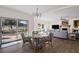 Dining area with glass-top table, wicker chairs, and access to backyard at 1812 Turnberry Ter, Orlando, FL 32804