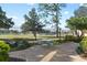 Relaxing patio with table and chairs, offering a golf course view at 1812 Turnberry Ter, Orlando, FL 32804