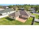 Aerial shot of home backyard featuring brick patio and expansive lawn at 1834 Roper Rd, St Cloud, FL 34771