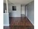 Living room with dark wood floors and light walls at 1928 Conway Rd # 23, Orlando, FL 32812