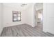 Dining area with gray vinyl flooring and an archway to the kitchen at 2006 Key Lime St, Ocoee, FL 34761