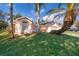 Two-story house with a landscaped yard and palm trees at 2006 Key Lime St, Ocoee, FL 34761