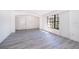 Bright living room featuring gray vinyl plank flooring and a large window at 2006 Key Lime St, Ocoee, FL 34761