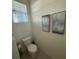 Clean and simple bathroom with white toilet and vanity at 2252 Tay Wes Dr, St Cloud, FL 34771