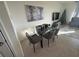 Modern dining room featuring glass table and gray chairs at 2252 Tay Wes Dr, St Cloud, FL 34771