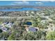 Aerial view of house and lot, showcasing a pond, lake, and surrounding neighborhood at 2323 Tuskawilla Rd, Oviedo, FL 32765