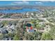 Aerial view of house and lot, showcasing a pond, lake, and surrounding neighborhood at 2323 Tuskawilla Rd, Oviedo, FL 32765