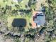 House with large backyard, pond, and brick patio at 2323 Tuskawilla Rd, Oviedo, FL 32765