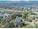 Aerial view of house and lot, showcasing a pond, lake, and surrounding neighborhood at 2323 Tuskawilla Rd, Oviedo, FL 32765