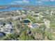 Aerial view of house and lot, showcasing a pond, lake, and surrounding neighborhood at 2323 Tuskawilla Rd, Oviedo, FL 32765