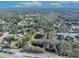 Aerial view showing property lines of house and pond at 2323 Tuskawilla Rd, Oviedo, FL 32765