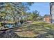 Landscaped backyard with a tranquil waterway and lush trees at 2323 Tuskawilla Rd, Oviedo, FL 32765