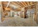 Unfinished basement with exposed beams, framing, and concrete flooring at 2323 Tuskawilla Rd, Oviedo, FL 32765