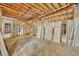 Unfinished basement with exposed framing and concrete floor at 2323 Tuskawilla Rd, Oviedo, FL 32765