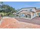 White building with covered carport and brick paver driveway at 2323 Tuskawilla Rd, Oviedo, FL 32765