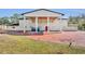 Brick paved driveway leading to a large white house under construction with a covered entryway at 2323 Tuskawilla Rd, Oviedo, FL 32765