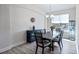 Formal dining room with dark wood table, gray chairs, and a chandelier at 24414 Woodhill Ct, Sorrento, FL 32776