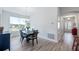 Dining room with dark wood table and chairs, near the home's entryway at 24414 Woodhill Ct, Sorrento, FL 32776