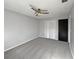 Spacious bedroom featuring gray carpet, ceiling fan, and built-in closet at 270 Debary Dr, Debary, FL 32713