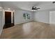 Living room featuring light wood laminate flooring and a large window at 270 Debary Dr, Debary, FL 32713