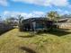 Inviting screened pool area with a large backyard at 270 Debary Dr, Debary, FL 32713