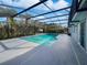 Refreshing pool with a screened enclosure in the backyard at 270 Debary Dr, Debary, FL 32713