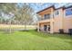 Backyard with grass and grill at 2720 Bushman Dr, Kissimmee, FL 34746