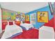 ' bedroom with a Mickey Mouse theme and twin beds at 2720 Bushman Dr, Kissimmee, FL 34746